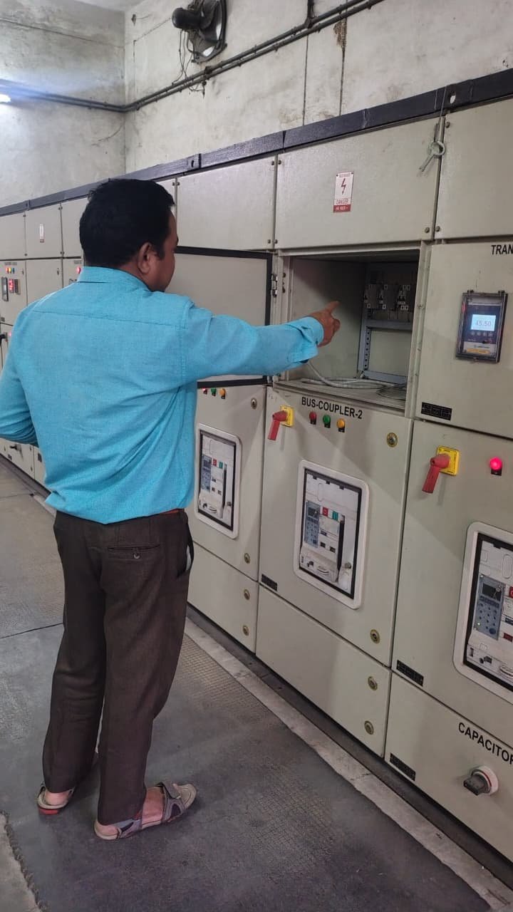 Technician carrying out electrical panel maintenance
